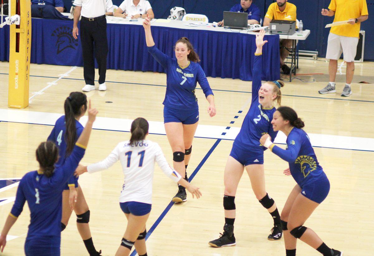 Sophomore middle blocker Haylee Nelson (left) and sophomore setter Mamie Garard (right) celebrate the match point in Saturday&#8217;s victory over Marist College. The Spartans won 1 of the 3 matches in the South Bay Battle. Chris Core/Spartan Daily 