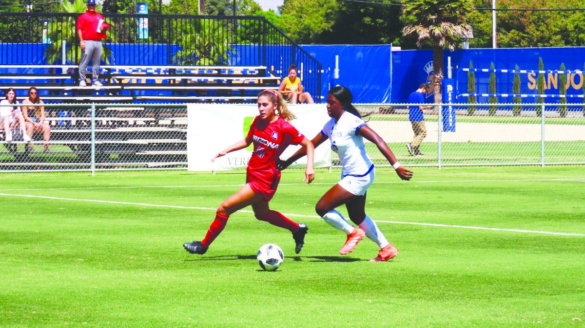 Freshman midfielder Alexis Brewah competes for the ball during the match against University of Arizona at Spartan Soccer Complex on Sunday. Christian Trujano/Spartan Daily 
