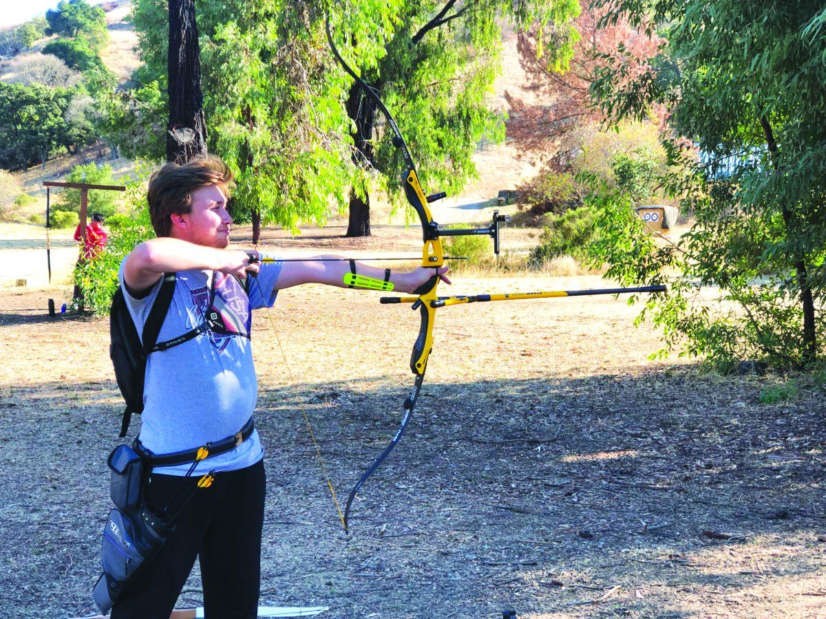 Archery team vice president Christopher Plumeau practices his skills at the range at Black Mountain Bowmen. / Nathan Doyle