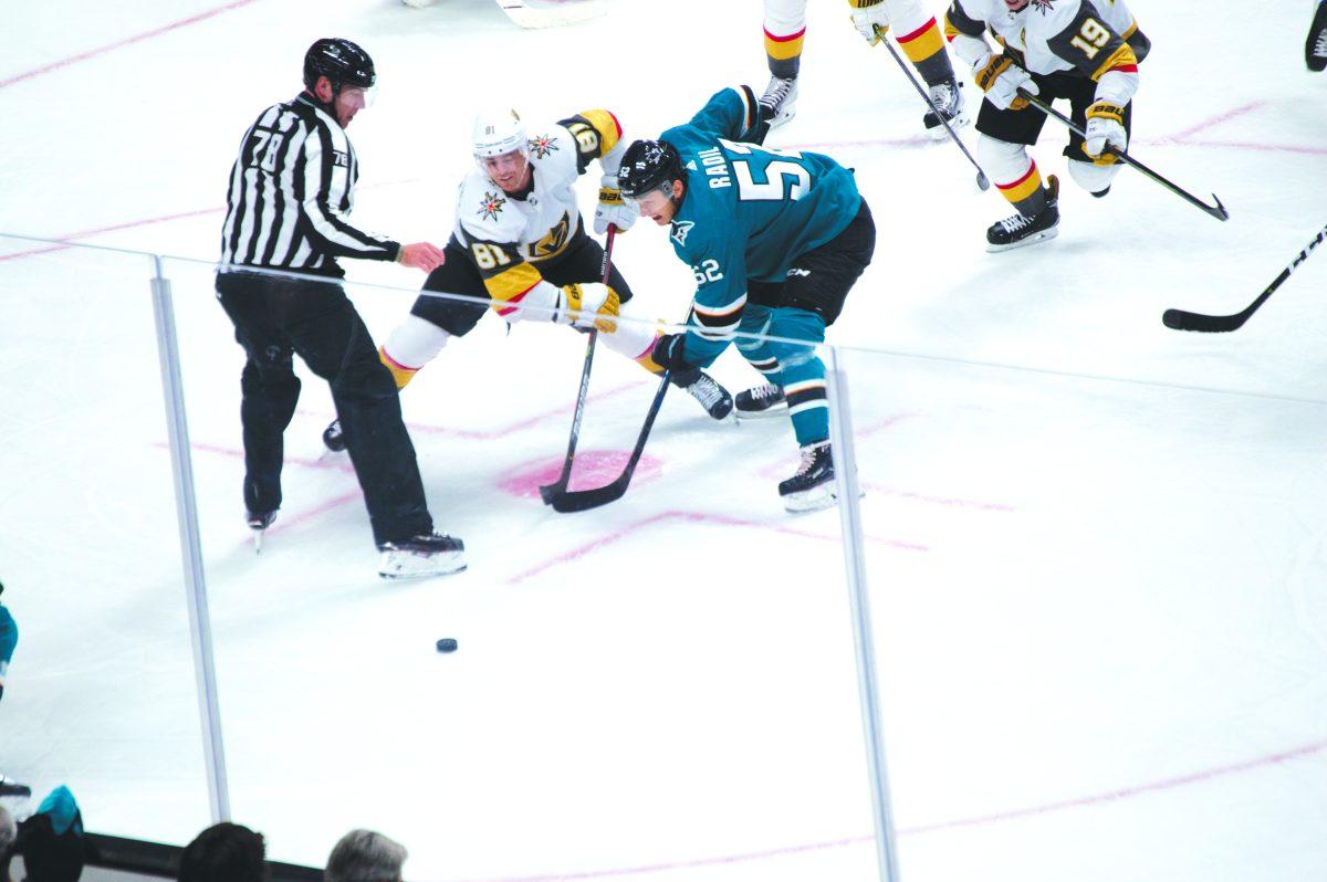 Vegas Golden Knights center Jonathan Marchessault and San Jose Sharks center Lukas Radil prepare for a face off during the Sharks&#8217; home opener at the SAP Center. /Jesus Tellitud