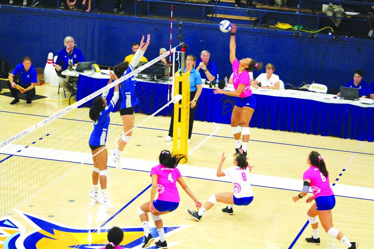 Redshirt junior outside hitter Latahevai Lousi nails the spike on her way to a team-high 11 kills against Air Force. / Chris Core