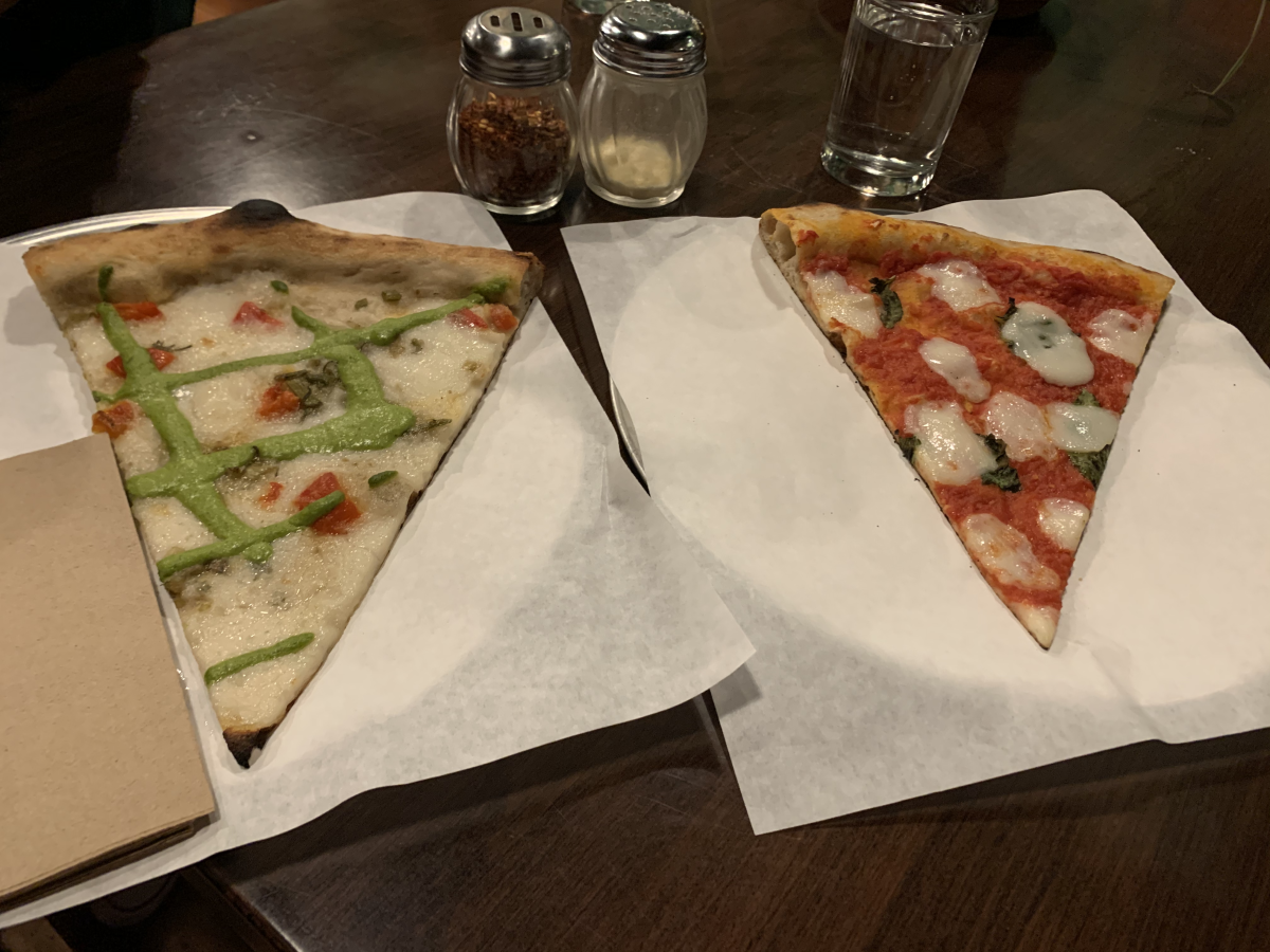 Pizza Flora, located on South First street, offers up slices of Spring Cream (left) and Margherita (right) pizza. Photo by Chris Core.