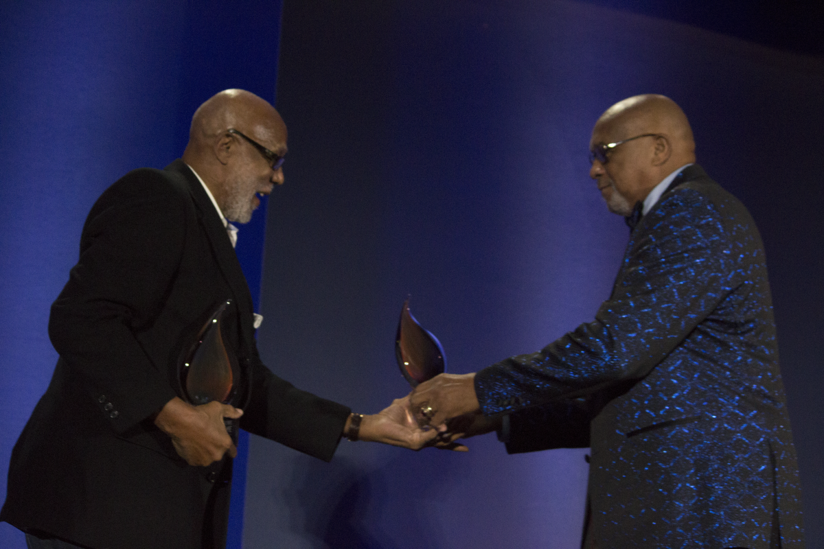 Tommie Smith (right) and John Carlos are given trophies after finally being inducted into the U.S. Olympic and Paralympic Hall of Fame, 51 years after their iconic protest.  Mauricio La Plante/Spartan Daily archives