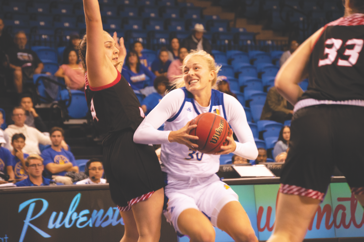Junior guard Megan Anderson goes for the layup during Friday&#8217;s home game against Eastern Washington University.