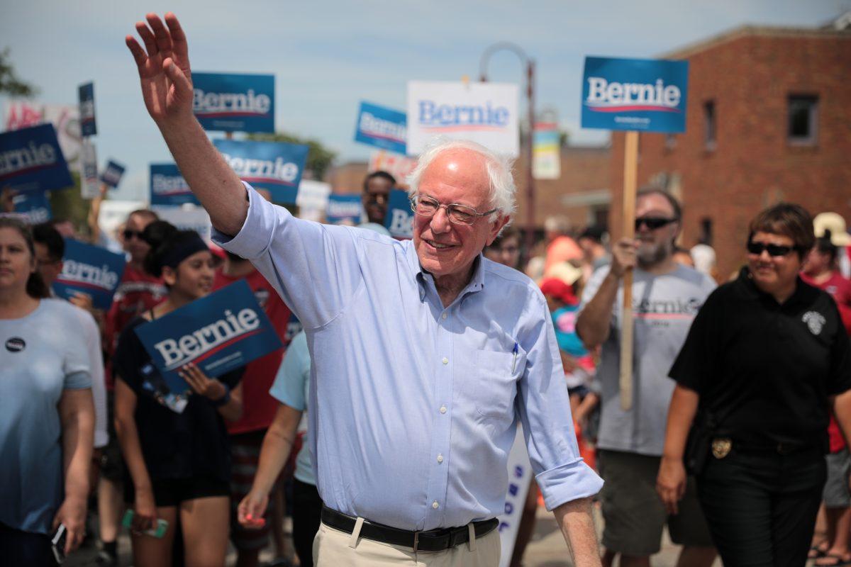 Presidential candidate Bernie Sanders marches during the Independence Day 2019 parade in Ames, Iowa. Photo Courtesy: Flicker