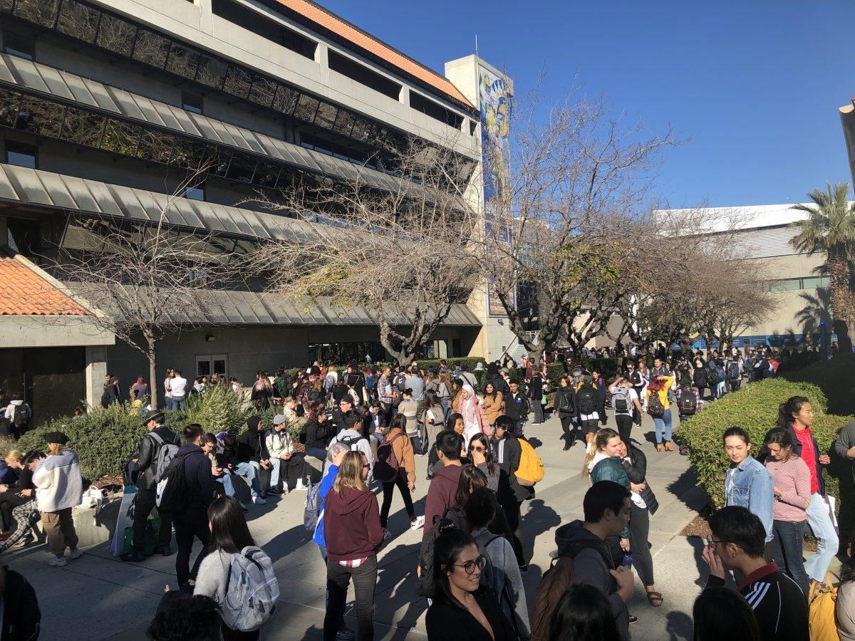 Students evacuating Clark Hall Thursday afternoon during a scheduled fire drill. Gia Pham/Spartan Daily