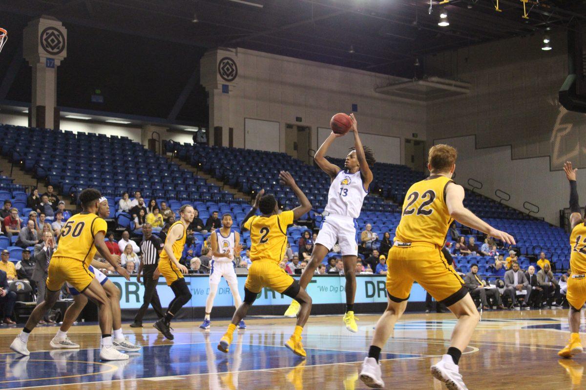 Sophomore guard Seneca Knight pulls up for the jumper against the University of Wyoming on his way to 21 points. Photo by Paul Hang.