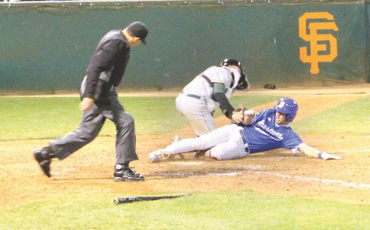 Sophomore Ryan Belluomini is thrown out in a close play at home plate in the bottom of the fifth inning. 