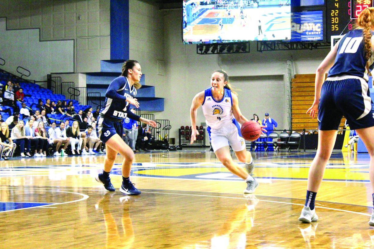 Senior guard Fieme&#8217;a Hafoka drives to the basket against Utah State freshman guard Kamalu Kamakawiwo&#8217;ole.