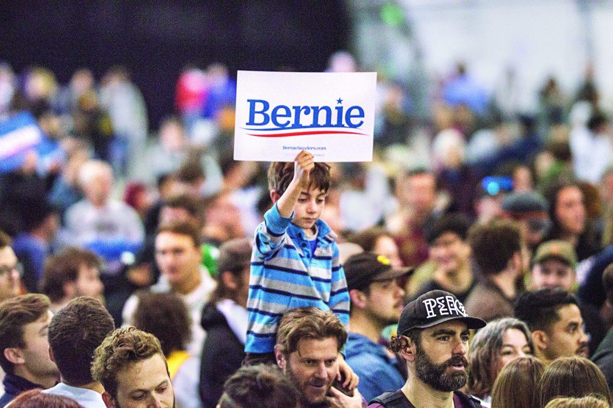 Caleaf Coltrin sits on his dad, Brian's shoulders during the Bernie Sanders rally Sunday in San Jose. Jesus Tellitud/Spartan Daily