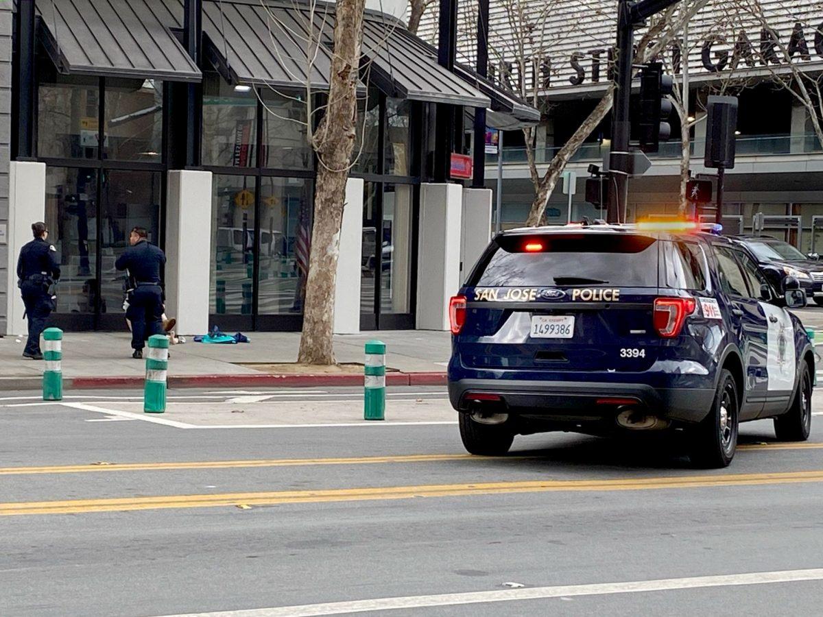 San Jose Police Department officers pull over to approach a man on East San Fernando Street near San Jose State Saturday afternoon. Mauricio La Plante/Spartan Daily
