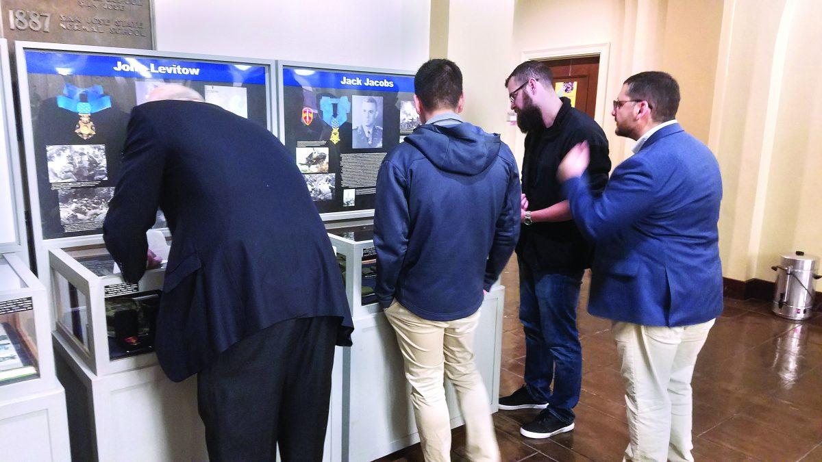 Audience members look at the exhibit, which honors Jewish American Medal of Honor recipients, Sunday at Tower Hall. Chris Padilla/Spartan Daily
