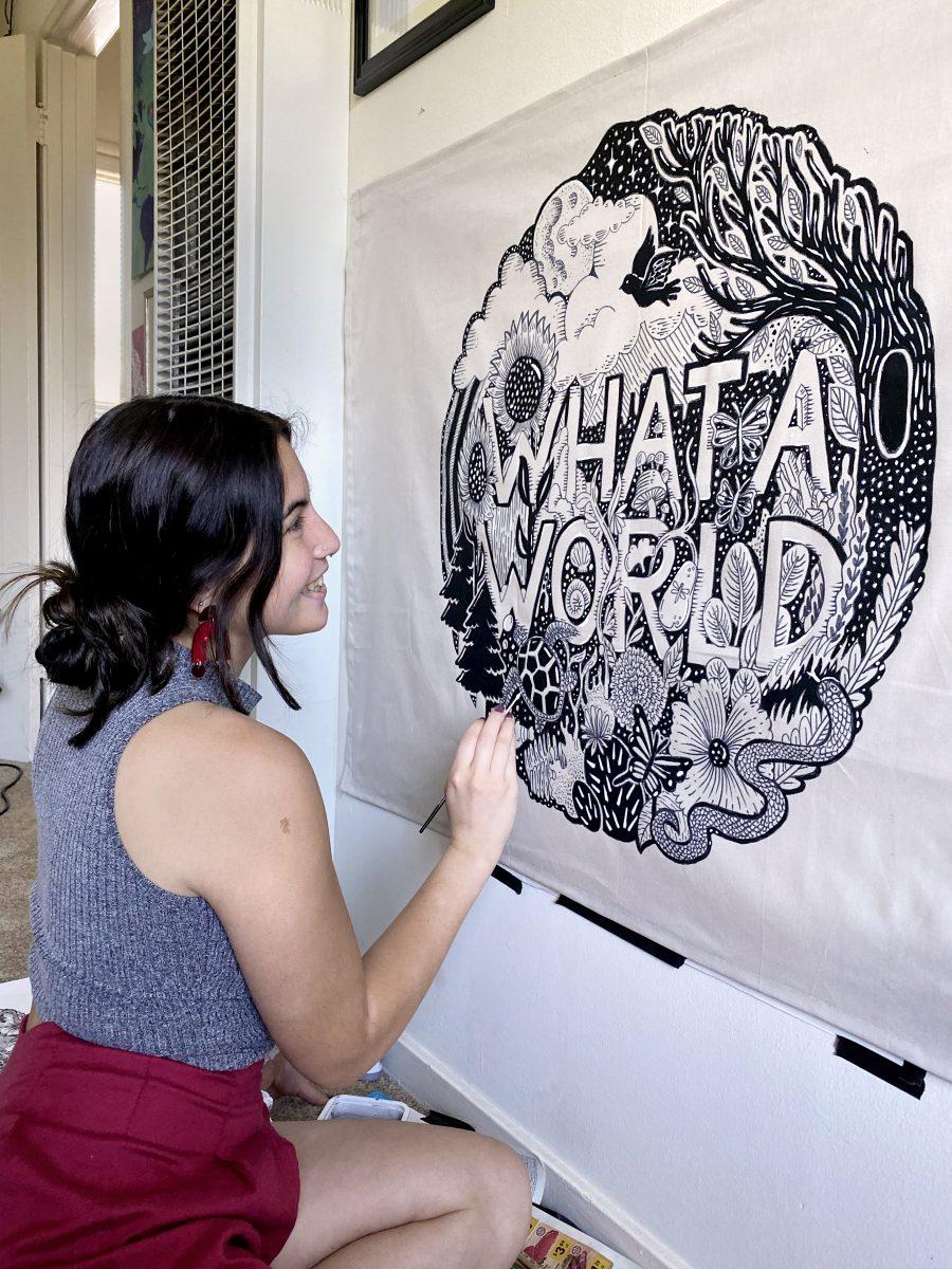 Local letterer, designer and muralist Alyssa Wigant paints a mural on her walls in celebration of Earth Day 2020 for the stay-at-home mural festival, HOME.