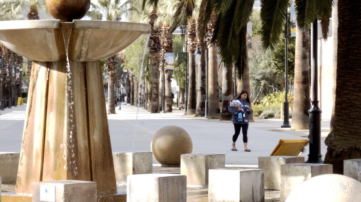 A San Jose State student walks through campus on March 16 when Santa Clara County health officials issued a shelter-in-place order. Christian Trujano/Spartan Daily