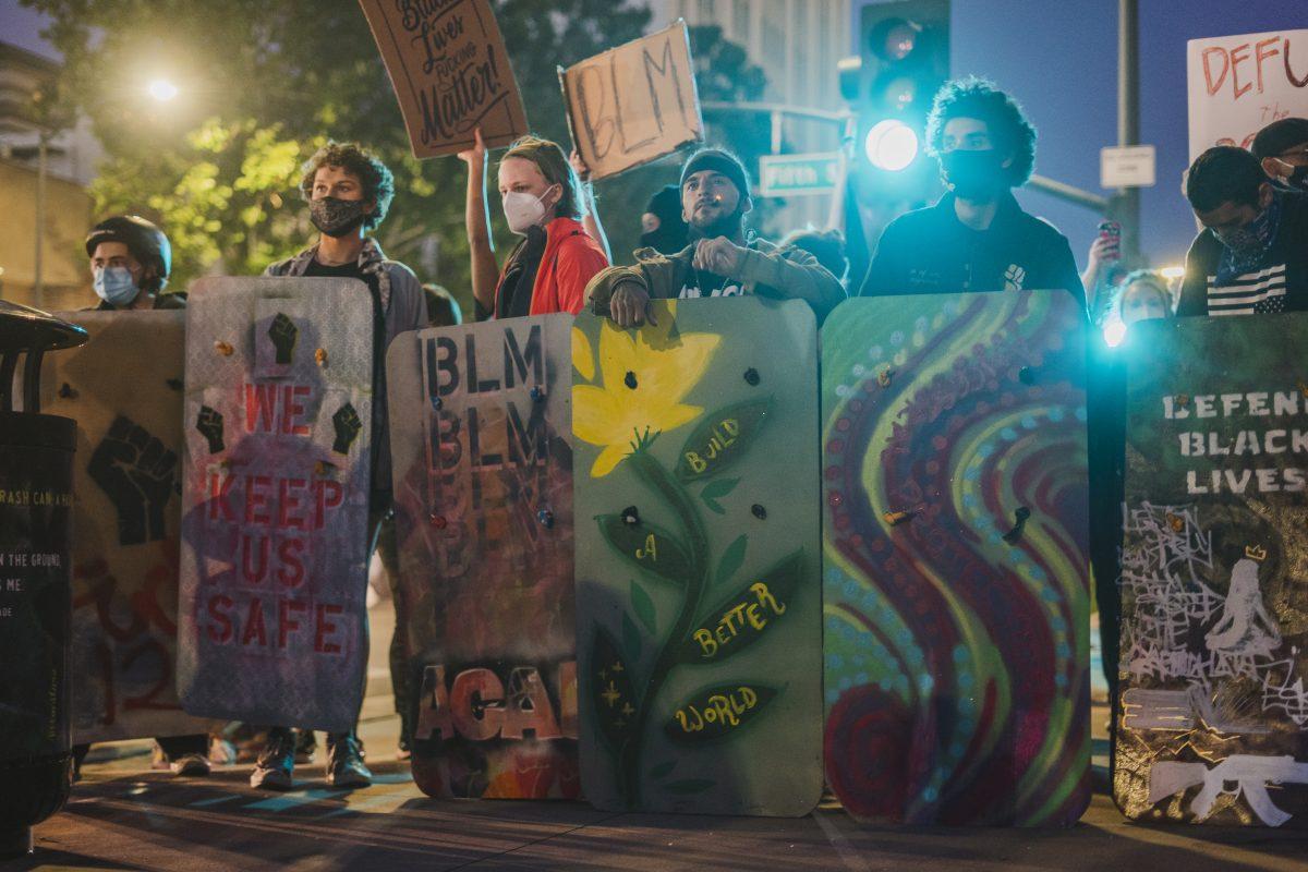 Handmade shields crafted by HERO Tent protected protesters on the front line of the march to SJPD in downtown San Jose on August 28. Jesus Tellitud/ Spartan Daily