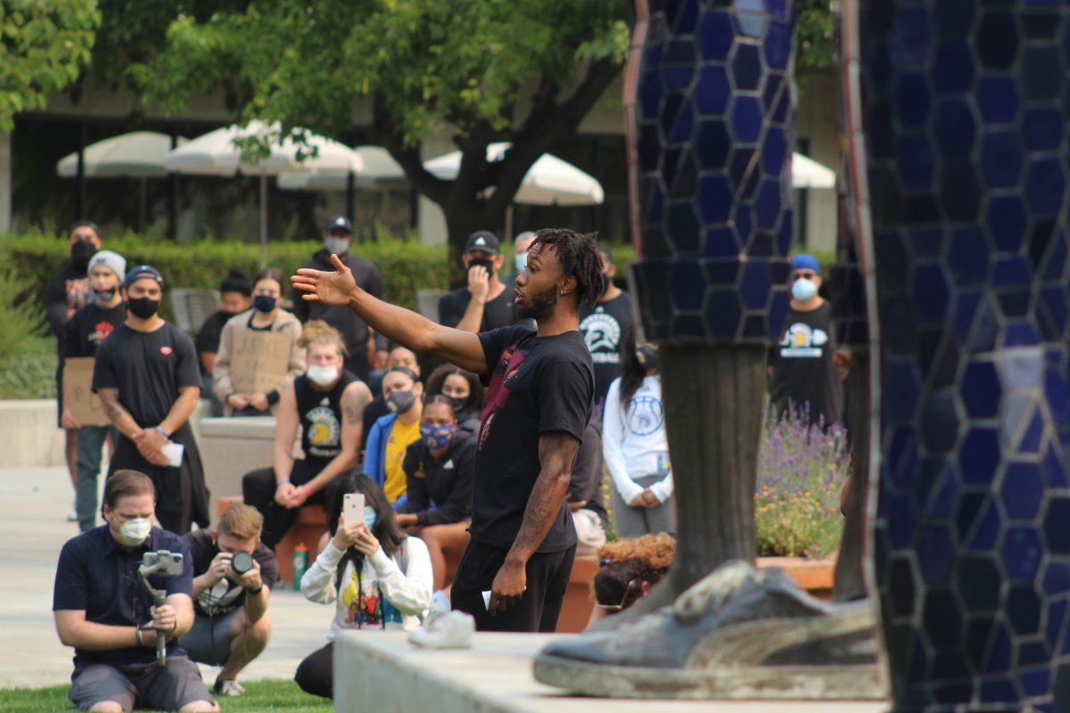 Caleb Simmons, SJSU men&#8217;s basketball guard, speaks to a crowd during the Black Lives Matter march led by the football team on Sept. 1. Photo Courtesy of Ernie Gonzalez