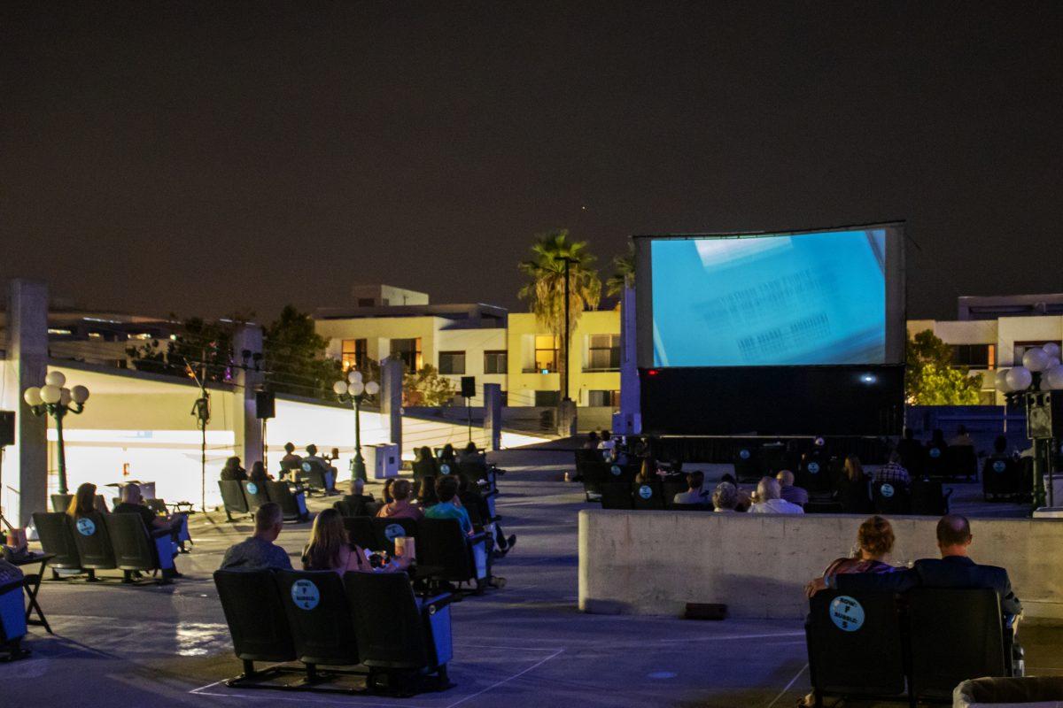 Attendees watch &#8220;The Post&#8221; atop the Second Street parking garage at a 3Below Theaters and Lounge screening on Friday.
