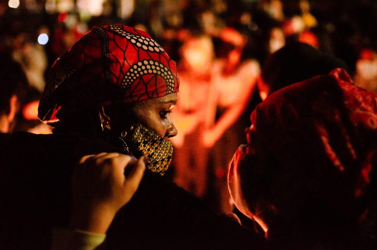 Denise Johnson is comforted by a protester during the Saturday night demonstration as she talks about how she suspects her son was murdered 12 years ago. Blue Nyguen/Spartan Daily. 