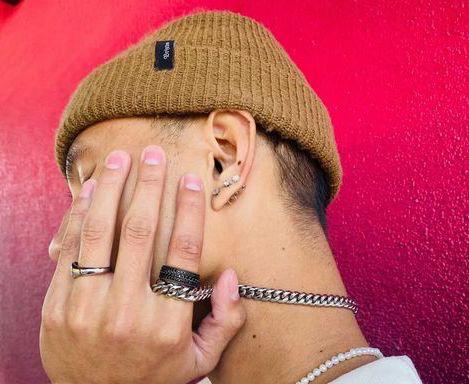 Business administration senior Brian Andres models the Ash ring and Nova necklace from the brand Meridiem the Label. Photo courtesy of Meridiem the Label.