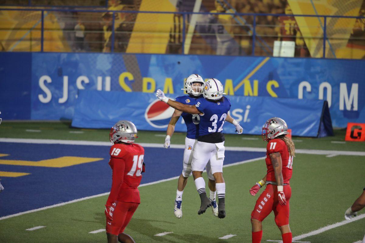 Receiver Bailey Gaither celebrates his 69-yard touchdown reception with running back Kairee Robinson (32) in SJSU&#8217;s victory over New Mexico Saturday at CEFCU Stadium. Photo Courtesy of SJSU Athletics.