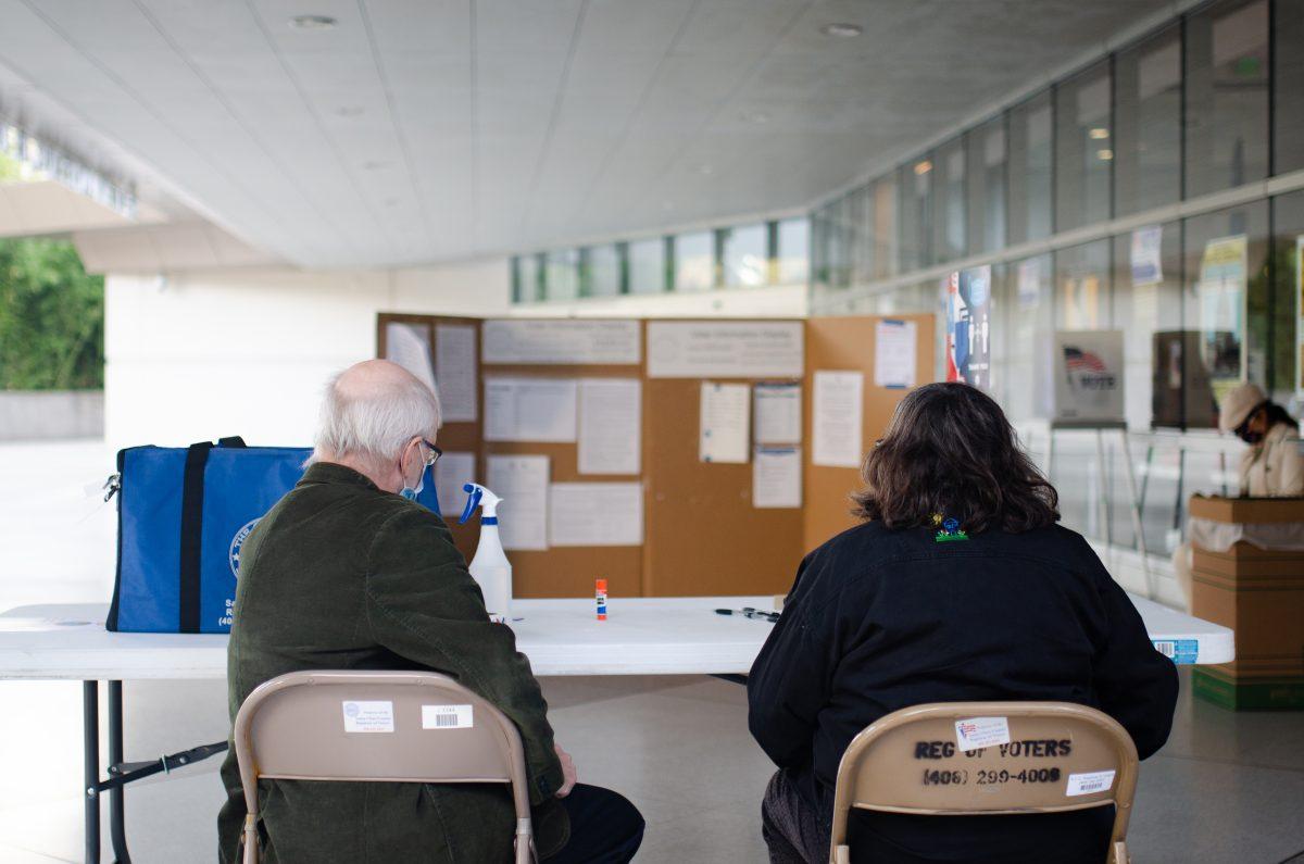 Election workers wait and prepare for voters outside the Dr. Martin Luther King Jr. Library. Workers sanitize all surfaces touched and masks are worn for COVID-19 safety. Blue Nguyen/ Spartan Daily.  