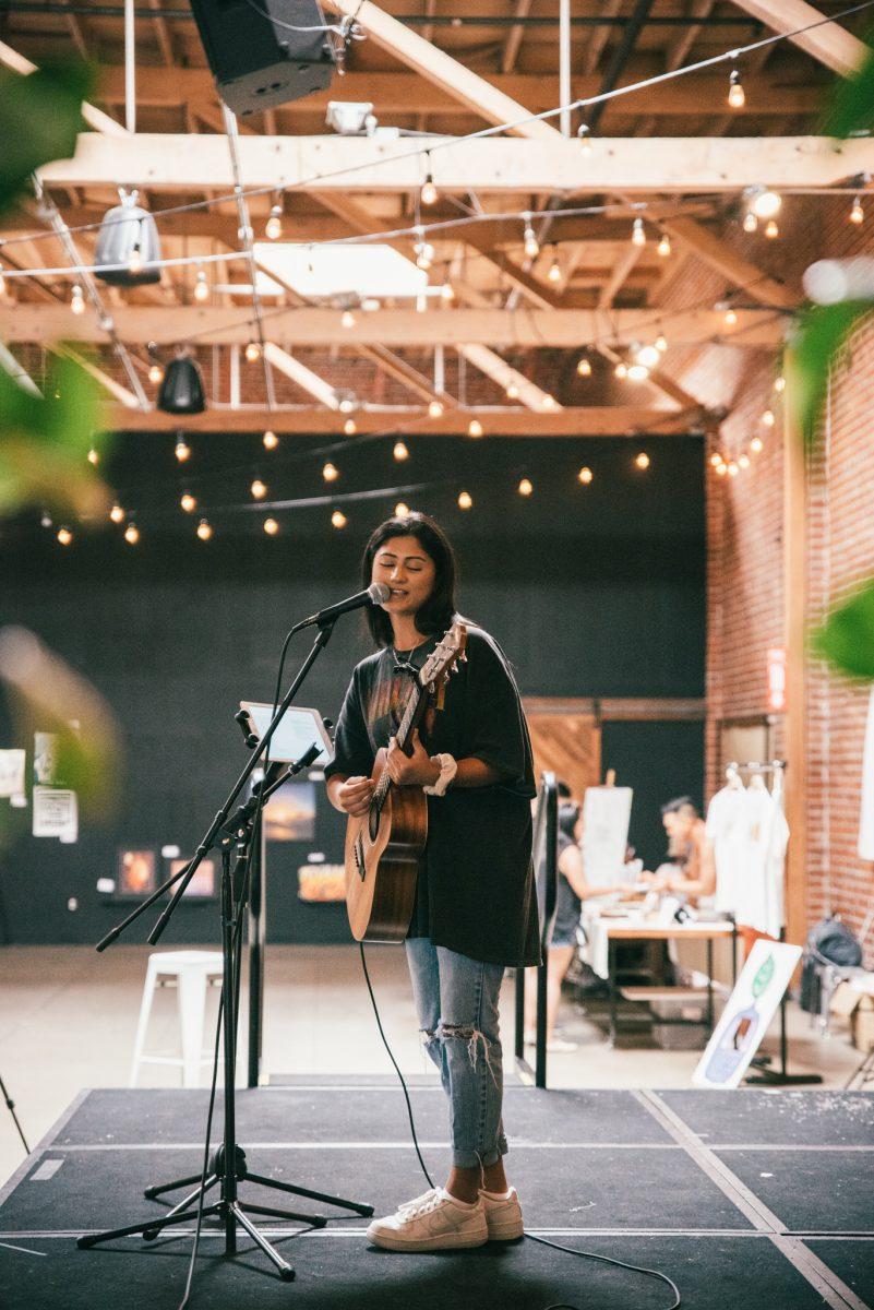 Ashley Mehta performs onstage at a Forager Tasting Room and Eatery event in 2019. Photo courtesy of Ashley Mehta.