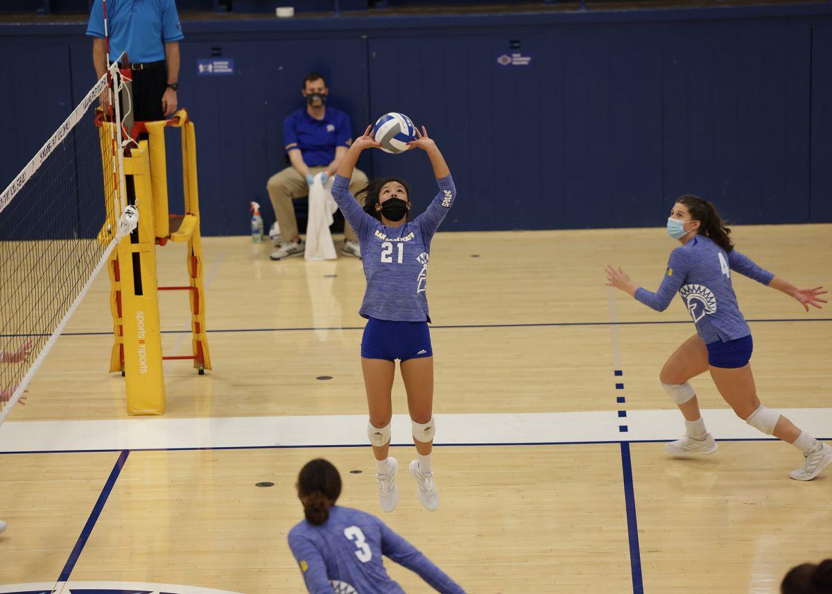 San Jose State setter Mia Schafer sets the ball for middle back Allyson Alden. Schafer began Set 2 with an ace for the Spartans.