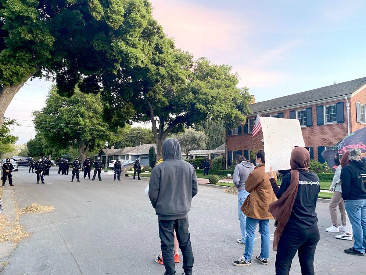 San Jose police officers block the house of San Jose State President Mary Papazian on University Way during a Sunday march that began at San Jose&#8217;s Municipal Rose Garden. Madilynne Medina | Spartan daily
