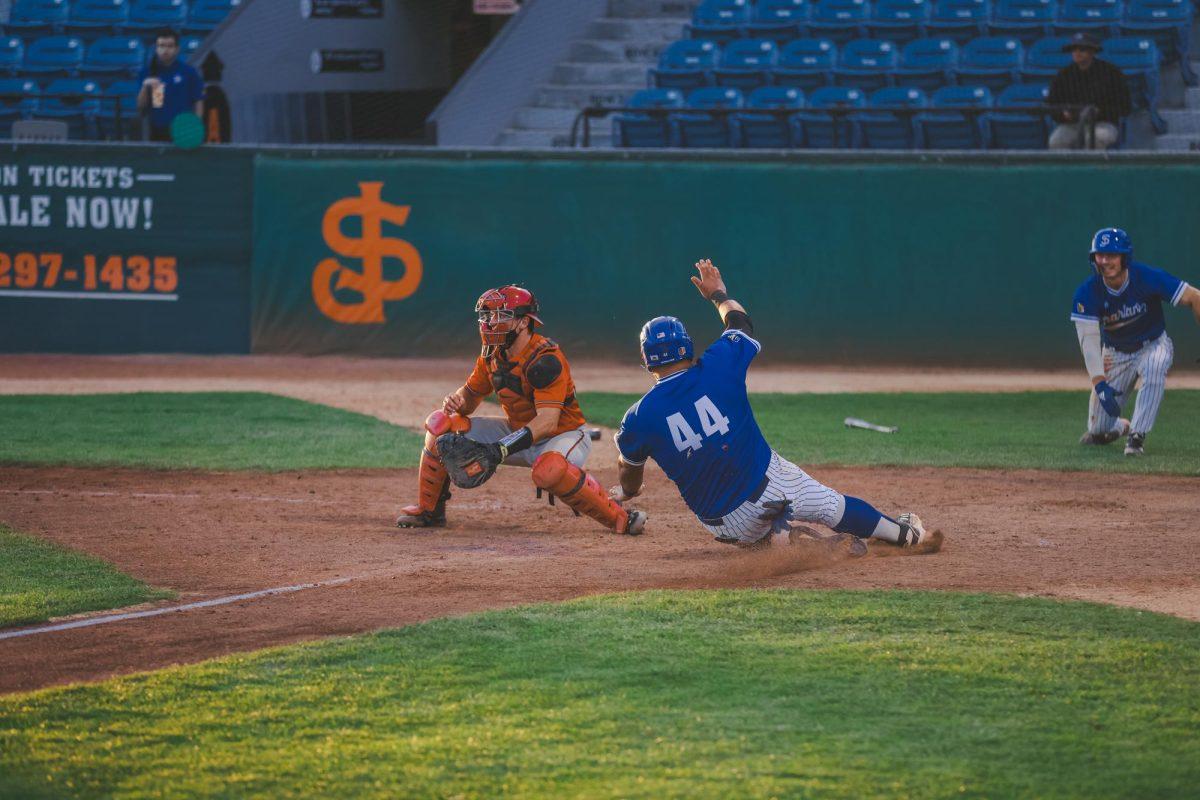 San Jose State infielder Ruben Ibarra slides into home plate. Ibarra had a solid day for the Spartans Sunday with a hit, an RBI and three walks.