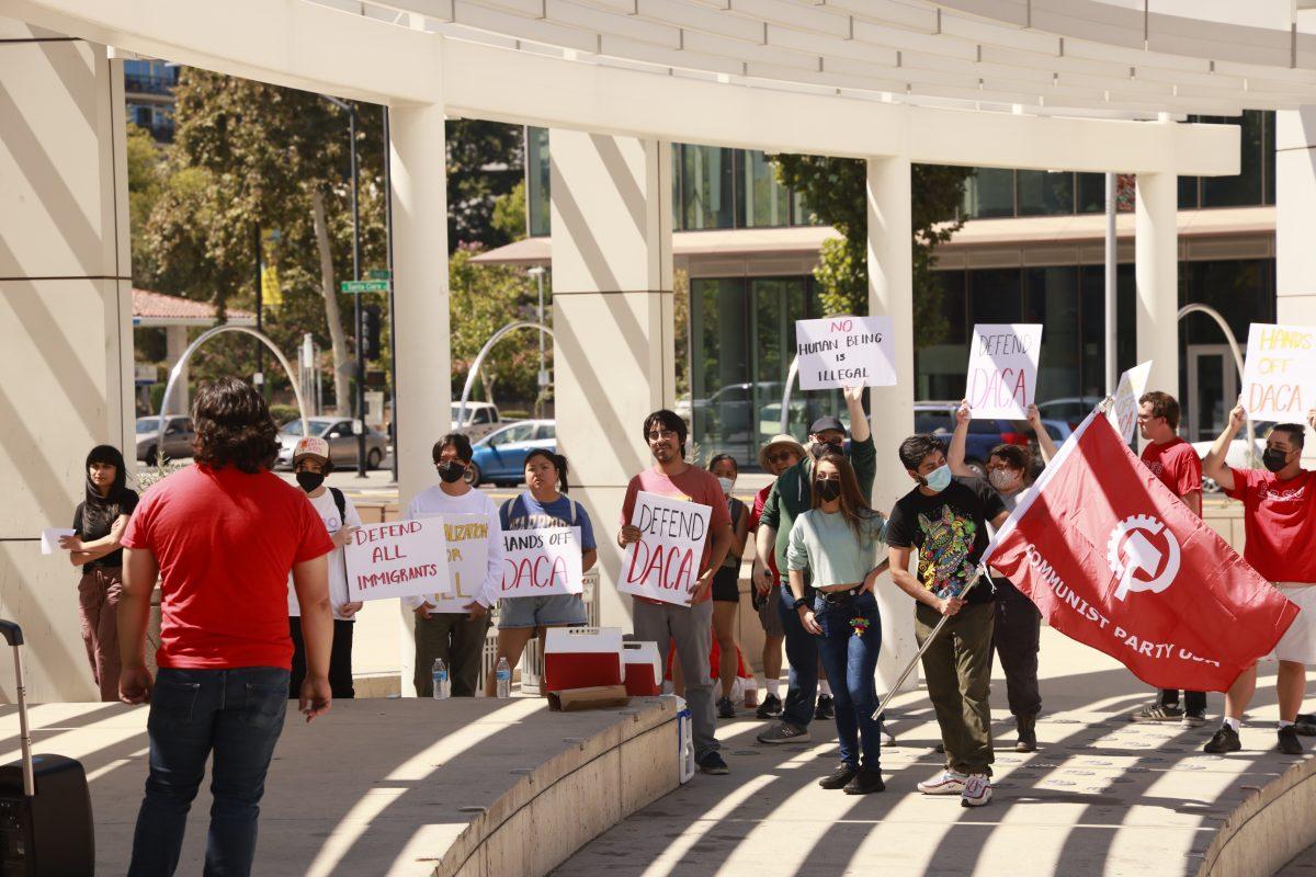 Local community members protest in front of San Jose City Hall on Sunday afternoon to advocate for defense of DACA. Nick Zamora | Spartan Daily