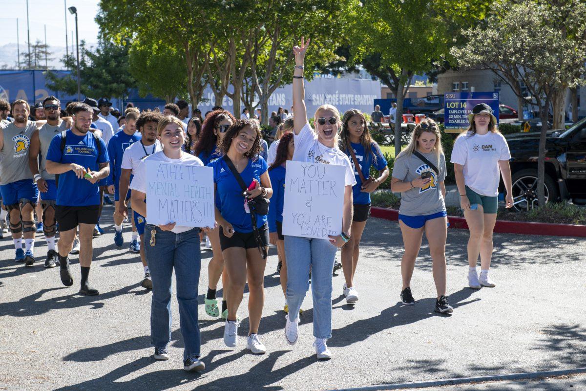 San Jose State student-athletes march in front of the Koret Athletic Training Center at South Campus on Sunday morning. Travis Wynn | Spartan Daily