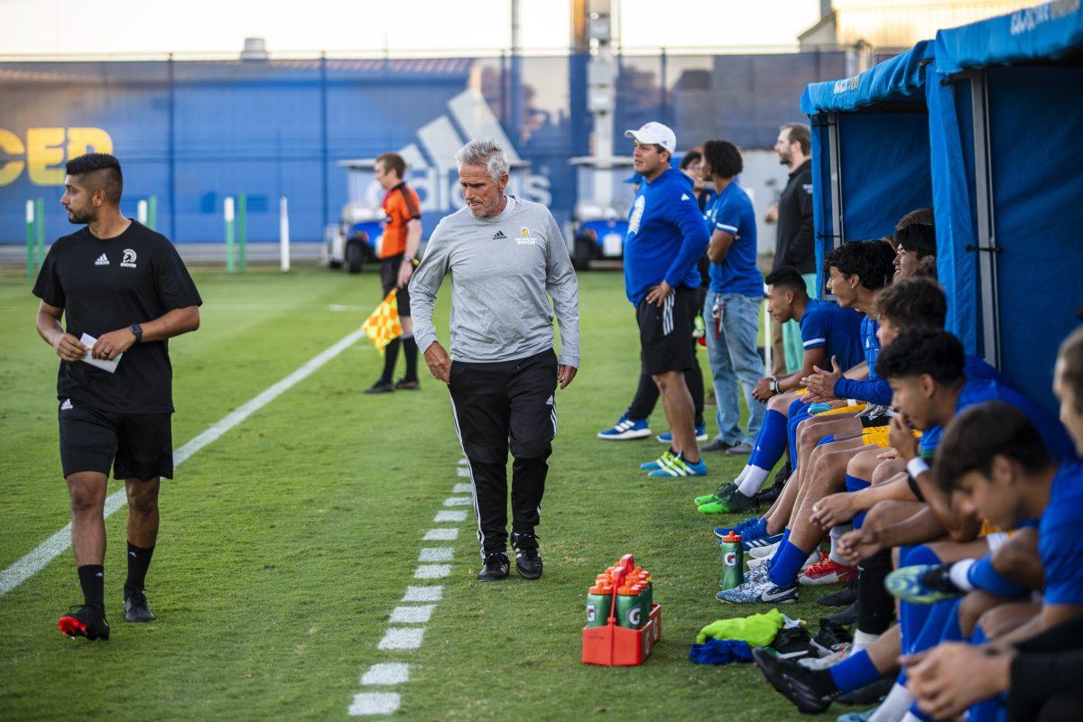 Simon Tobin, San Jose State men's soccer head coach, watches his team play against California State University Bakersfield on Thursday evening in the Spartan Soccer Complex. Travis Wynn | Spartan Daily