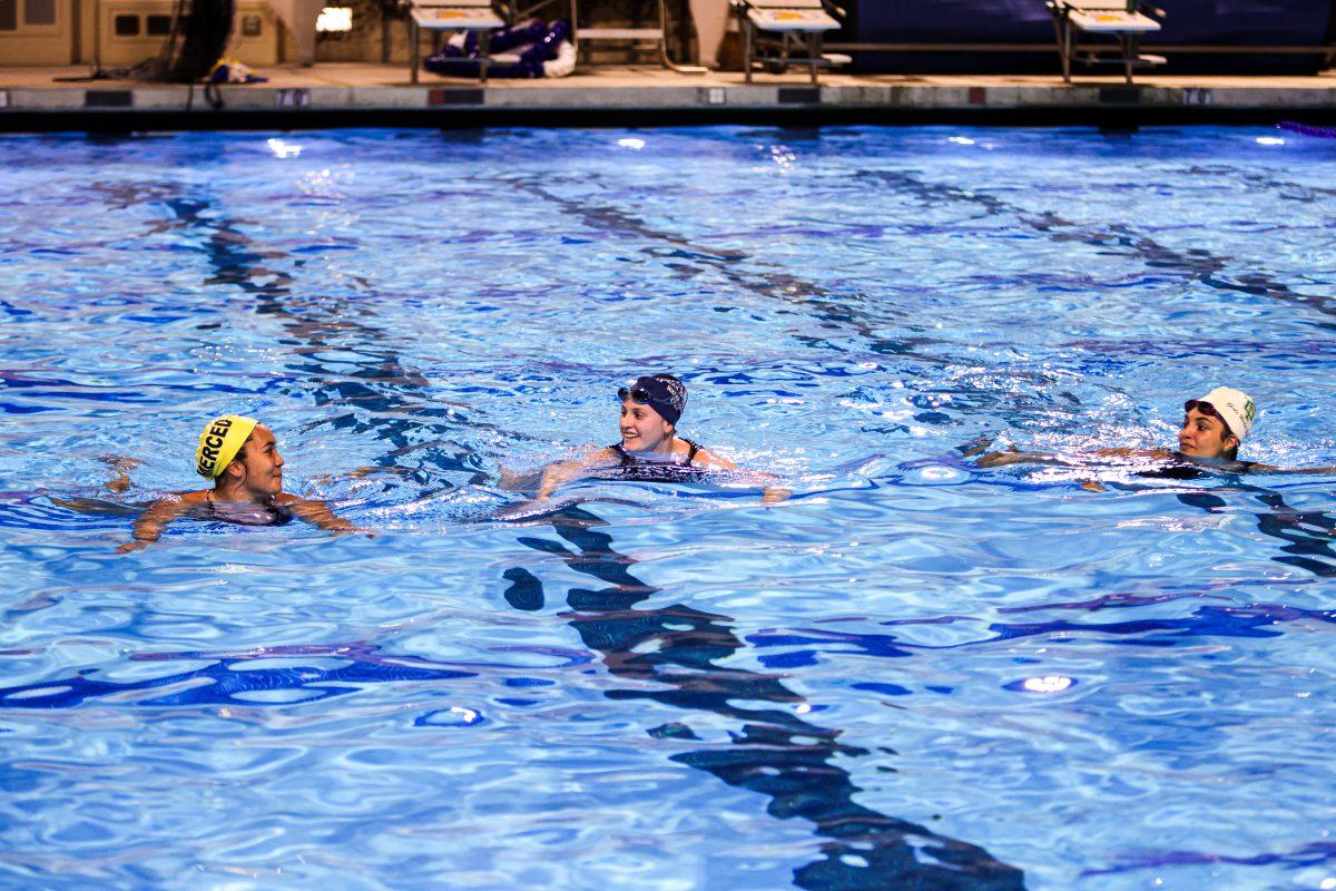 San Jose State kinesiology junior Katarina Capulong (left), kinesiology freshman Kasey Coughlin (middle) and Jade Moya, biological sciences and systems physiology freshman, warm up during practice on Sept. 7 at the Spartan Recreation and Aquatic Center. 
