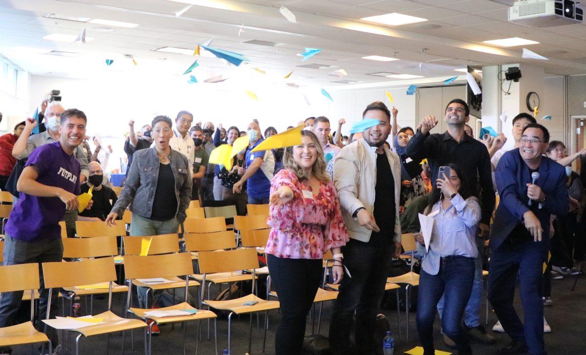 San Jose State students, faculty and alumni throw paper airplanes that have written notes of their aspirations in the Martin Luther King Jr. Library on Thursday. Alessio Cavalca | Spartan Daily