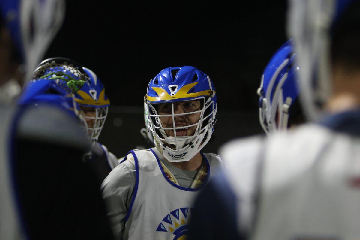 Jackson Christopulos, San Jose State club lacrosse player smiles in a huddle before a scrimmage. The Spartans finished the 2022 season 3-6 with a 2-3 record at home.