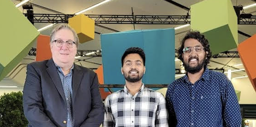 Intel Chief Technology Officer Greg Lavender (left) and SJSU students Ankur Singh (center) and Tirupati Venkata Sri Sai Rama Raju Penmatsa (right) smile for a photo after Singh and Penmatsa won the grand prize, as a team at the San Jose McEnery Convention