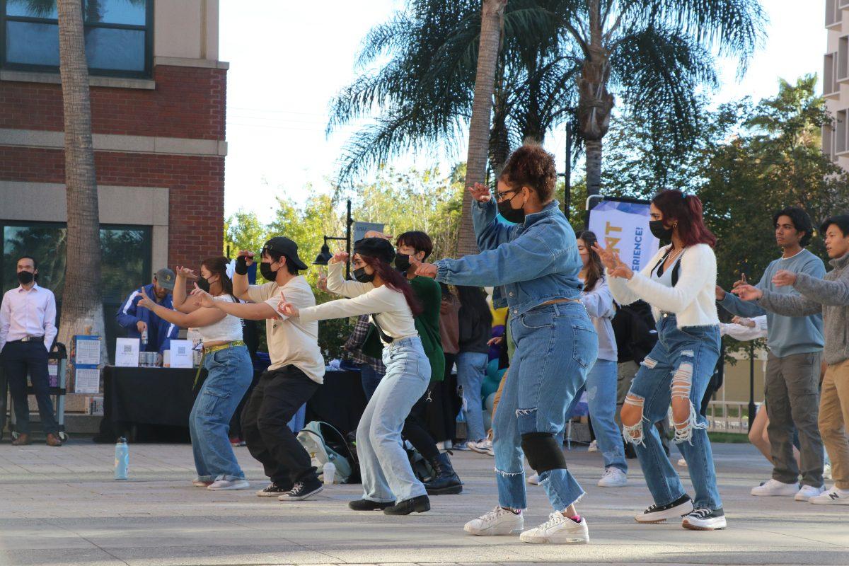 Photo by Jeremy Martin | Many students attended the K-pop popup event to learn K-pop choreography outside of Campus Village B on Thursday.