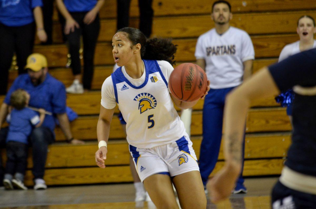 SJSU point guard Sidney Richards looks to the pass the ball on a fast break during the Spartans win over Utah State.