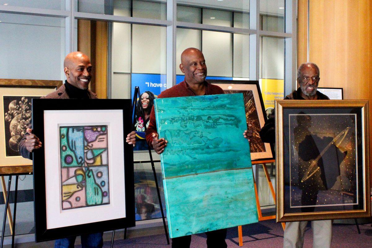 Kelvin Curry (left), Stephen Bruce (middle) and TheArthur Wright (right) share their art at the King Library on Friday.