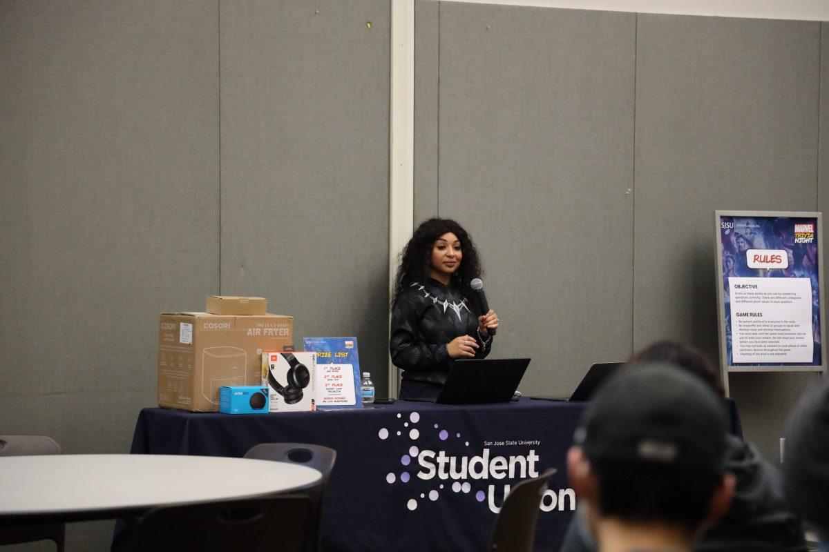 Event coordinator Shanall Sneed hosts Marvel Trivia Night at the Student Union on Thursday.