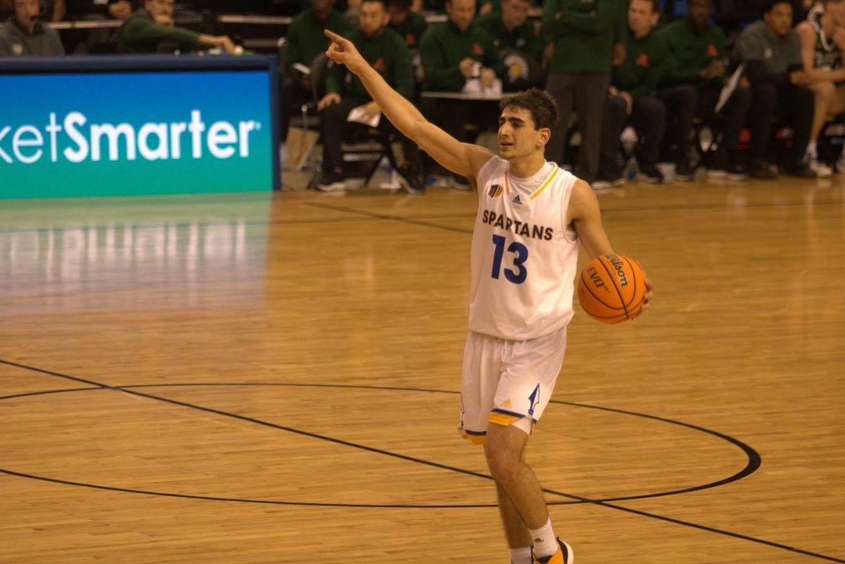 Sophomore point guard Alvaro Cardenas brings the ball up the court during Tuesday&#8217;s game against Colorado State. 