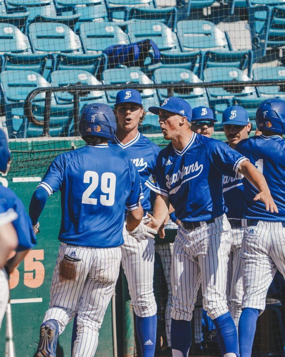 SJSU Pitcher Micky Thompson celebrates with catcher Matt Spears after a scored run during Saturday&#8217;s game against UNLV.