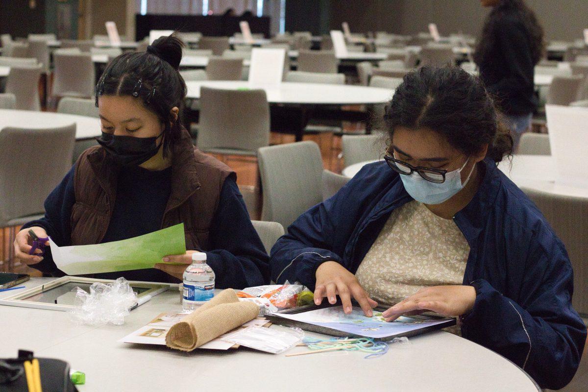 SJSU freshmen Ella Cereno and Julianna Ruidera work on their projects at the Fun with Frames event in the Student Union on Wednesday.