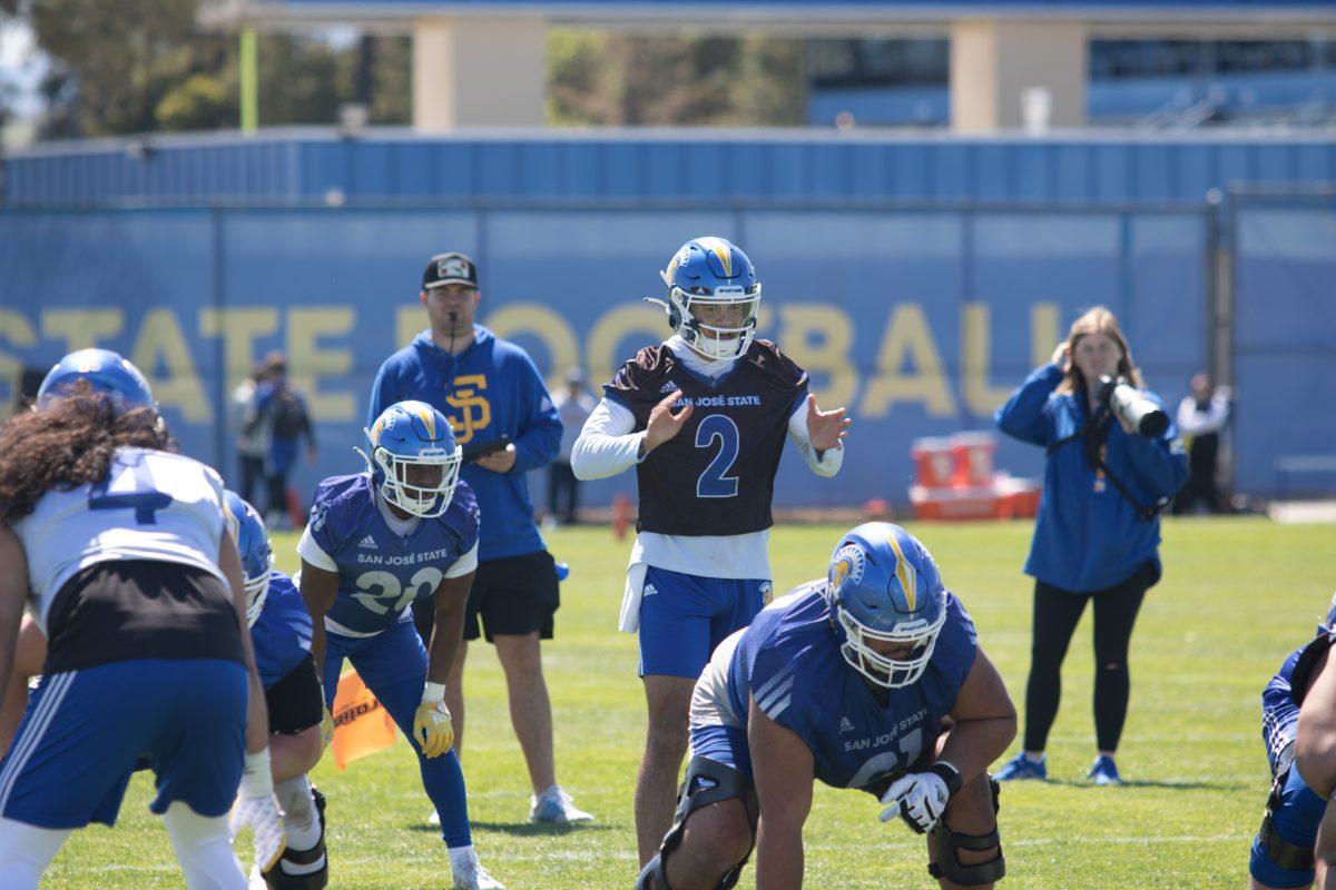 Quarterback Chevan Cordeiro hikes the ball during the Spartan&#8217;s first Spring practice on Tuesday at the football practice fields at South Campus.