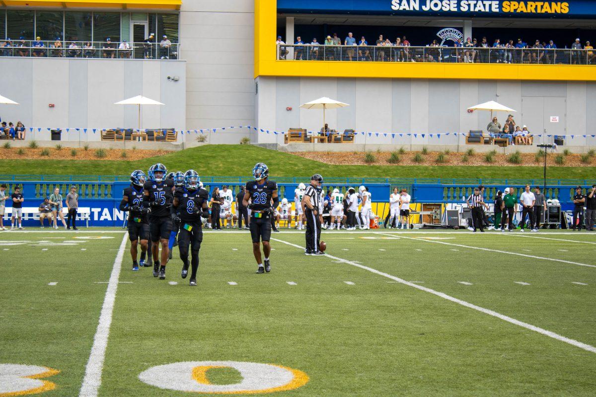 From left to right, Safety Andrew Jenkins, conerback Jalen Bainer, cornerback Jay Vion Cole and linebacker Ethan Powell jog to the line of scrimmage at CEFCU Stadium.