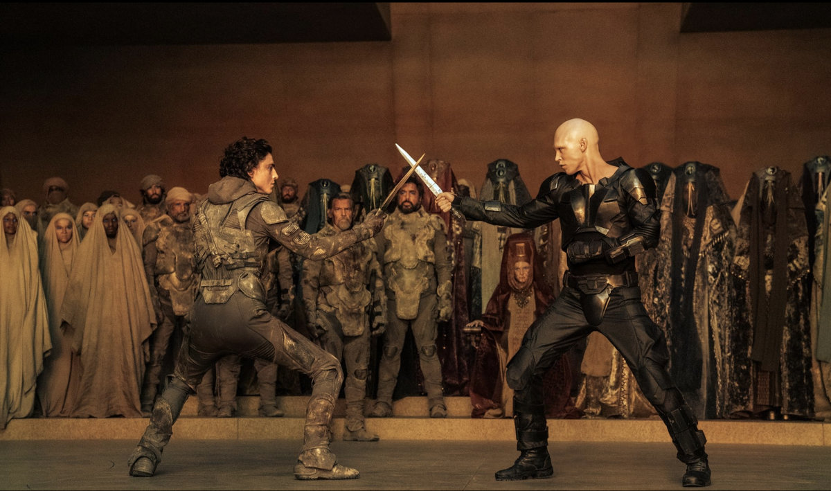 Paul Atreides, played by Timoth&#233;e Chalamet (left), clashes swords with Feyd-Rautha Harkonnen (right).