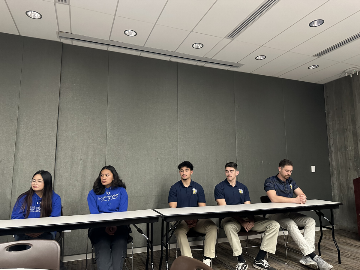 Men and women&#8217;s rugby sports club members attentively listen to members of media&#8217;s questions in the Student Union on Wednesday.