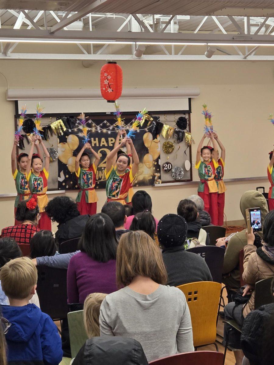 Traditional Vietnamese dancers from Vi&#234;t Steps perform a variation of M&#250;a D&#226;n Gian for Tully Community Branch Library.