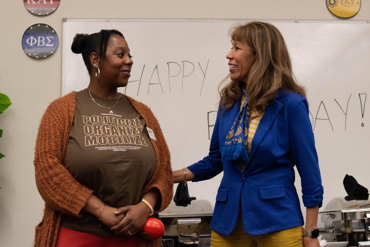 MyShaundriss Watkins, program coordinator for the BLOC, introduces SJSU President Cynthia Teniente-Matson before she begins to speak to students at the BLOC 7th Anniversary celebration.