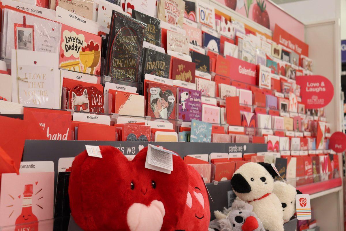 A menagarie of red and pink Valentine&#8217;s Day merchandise lines an aisle of a grocery store, advertised for customers to buy for their special someone on Feb. 14